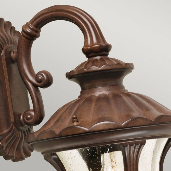 Chicago Wall Down Lantern Small with a rusty bronze patina finish