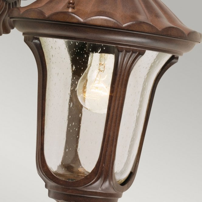Chicago Wall Down Lantern Small with a rusty bronze patina finish