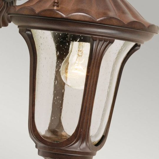 Chicago Wall Down Lantern Small with a rusty bronze patina finish