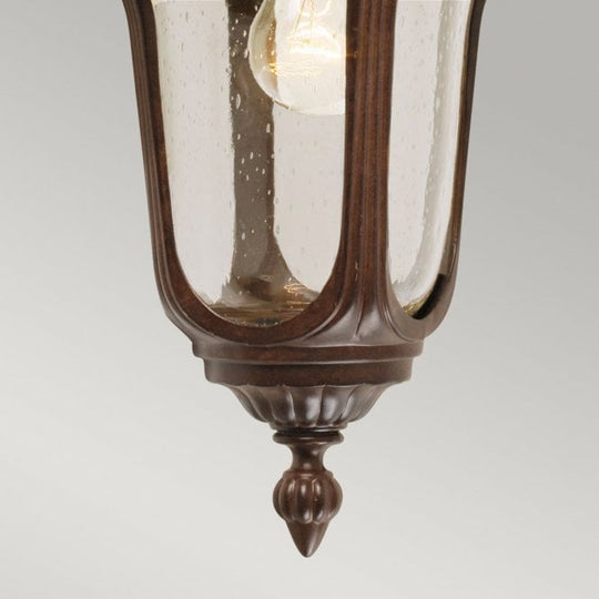 Chicago Wall Down Lantern Small with a rusty bronze patina finish