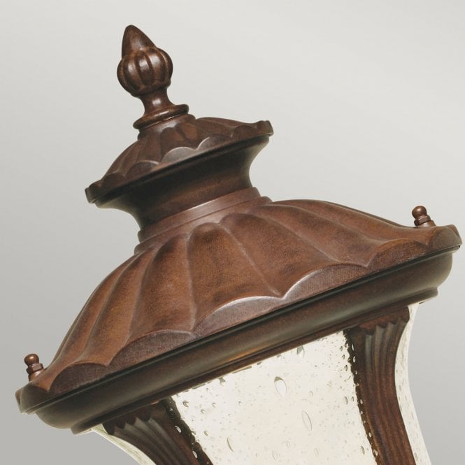 Chicago Pedestal Lantern Small with a rusty bronze patina finish