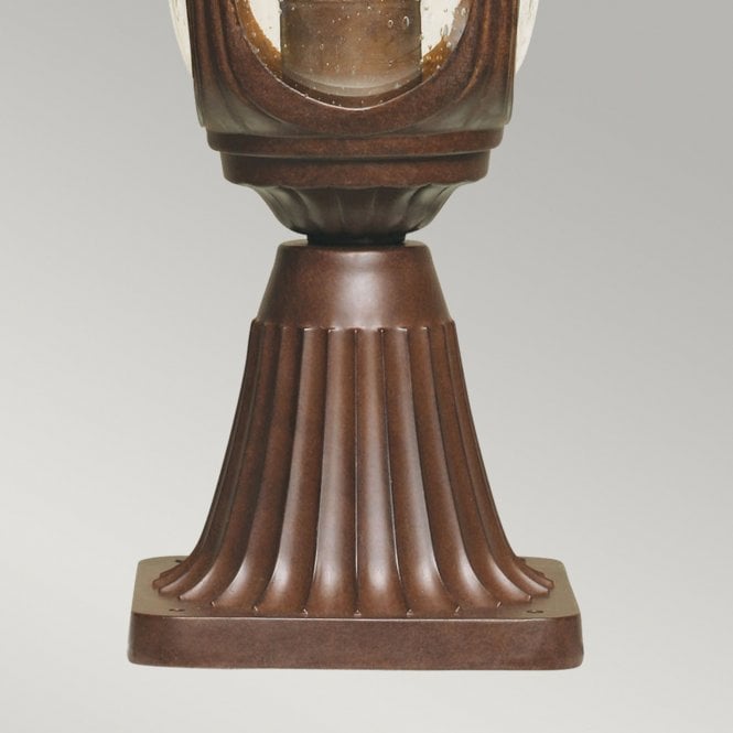 Chicago Pedestal Lantern Small with a rusty bronze patina finish