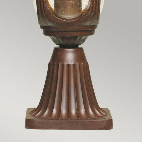Chicago Pedestal Lantern Small with a rusty bronze patina finish