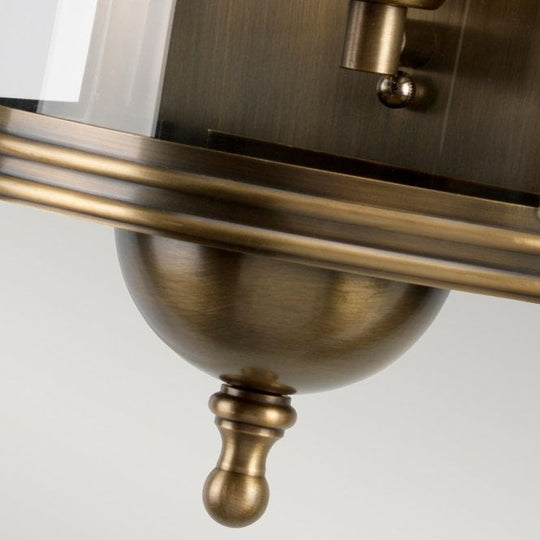 Downing Street Wall Lantern in a Brass finish